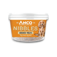 Stock image of the Anco Nibbles Chicken Treats, showing the packaging pot with a yellow label and a dog on the front.