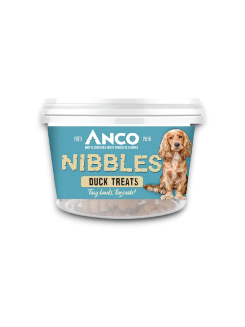 Stock image of the Anco Nibbles Duck Treats, showing the packaging pot with a blue label and a dog on the front.