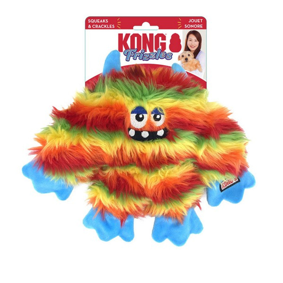 Stock image of the KONG Frizzles Zazzle, a shaggy monster plush toy with rainbow colours, against a white background.