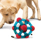 A stock image of a puppy playing with a KONG Rewards Tinker.