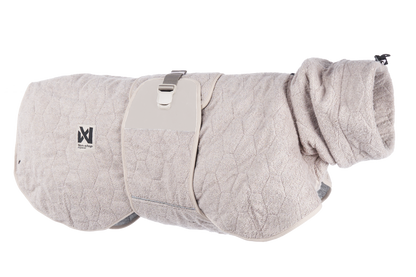 Stock image of the Drying Robe, in the sand colour, on a transparent background. Features hexagon lines, with Non-stop branding.