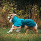 Lifestyle image of the Fjord Jacket 2.0 worn by a dog walking through grass.