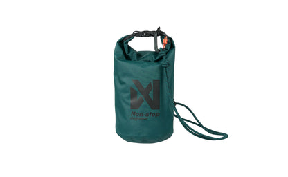 Stock image of the Multiuse Bag, a teal coloured, Non-stop branded bag, on a white background. Carabiner is clipped.