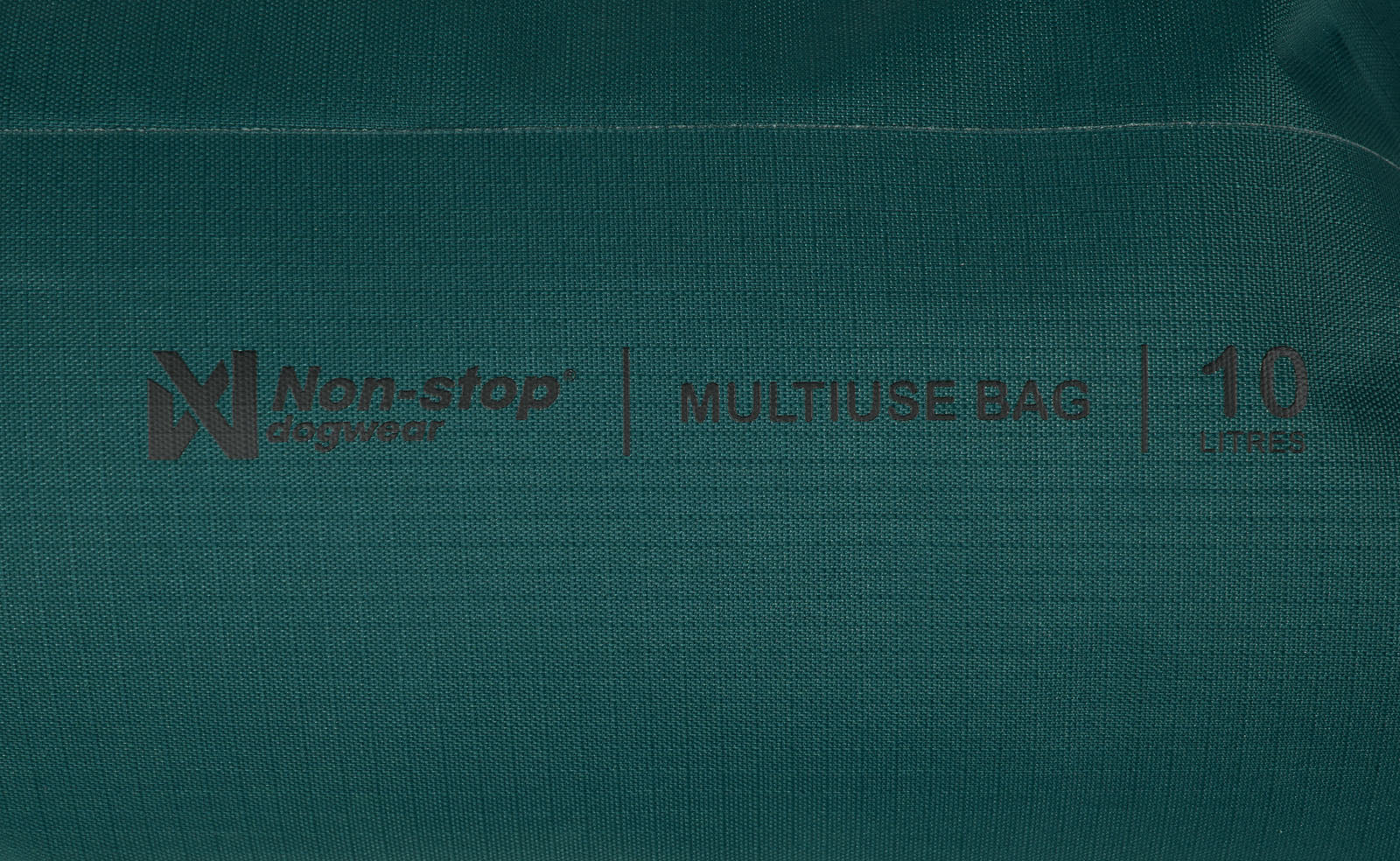 Stitched details of the Multiuse Bag, showing the Non-stop branding and size of the bag.