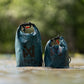 The two sizes of the Multiuse Bag, side by side, in a wet environment.