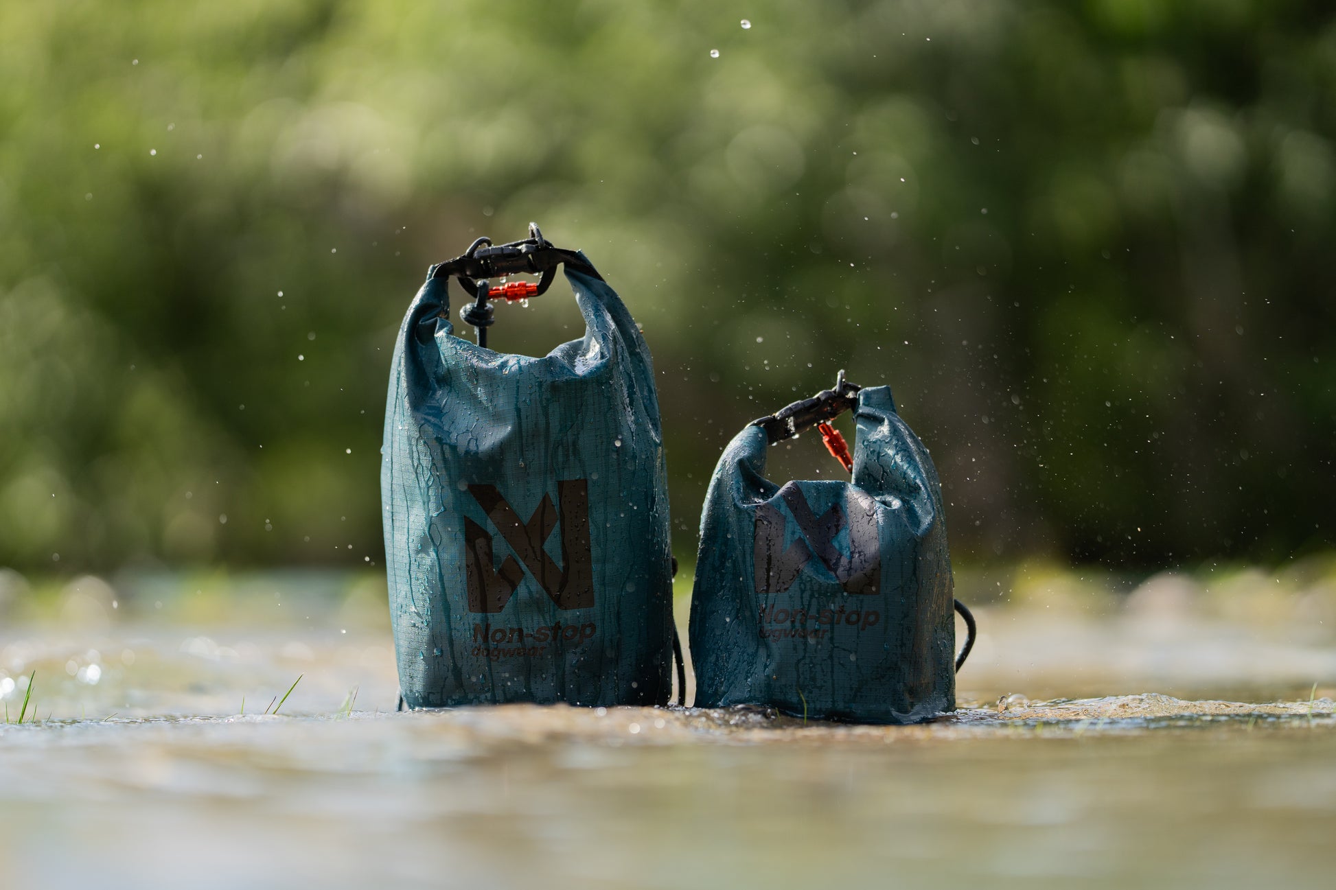 The two sizes of the Multiuse Bag, side by side, in a wet environment.