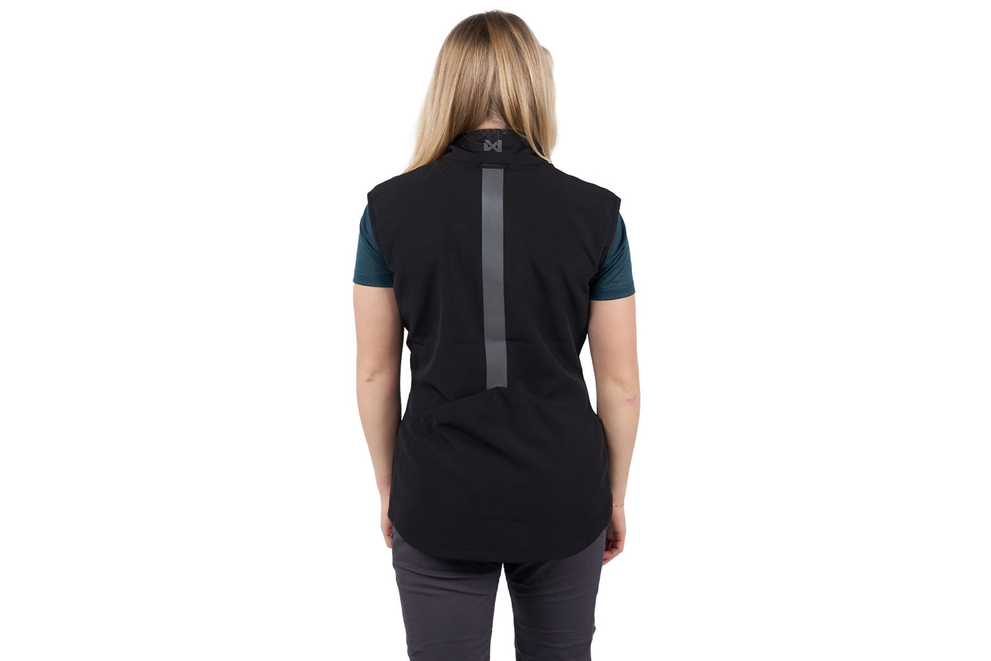 A woman wearing the Obedience Vest Light, with a reflective strip on the back.