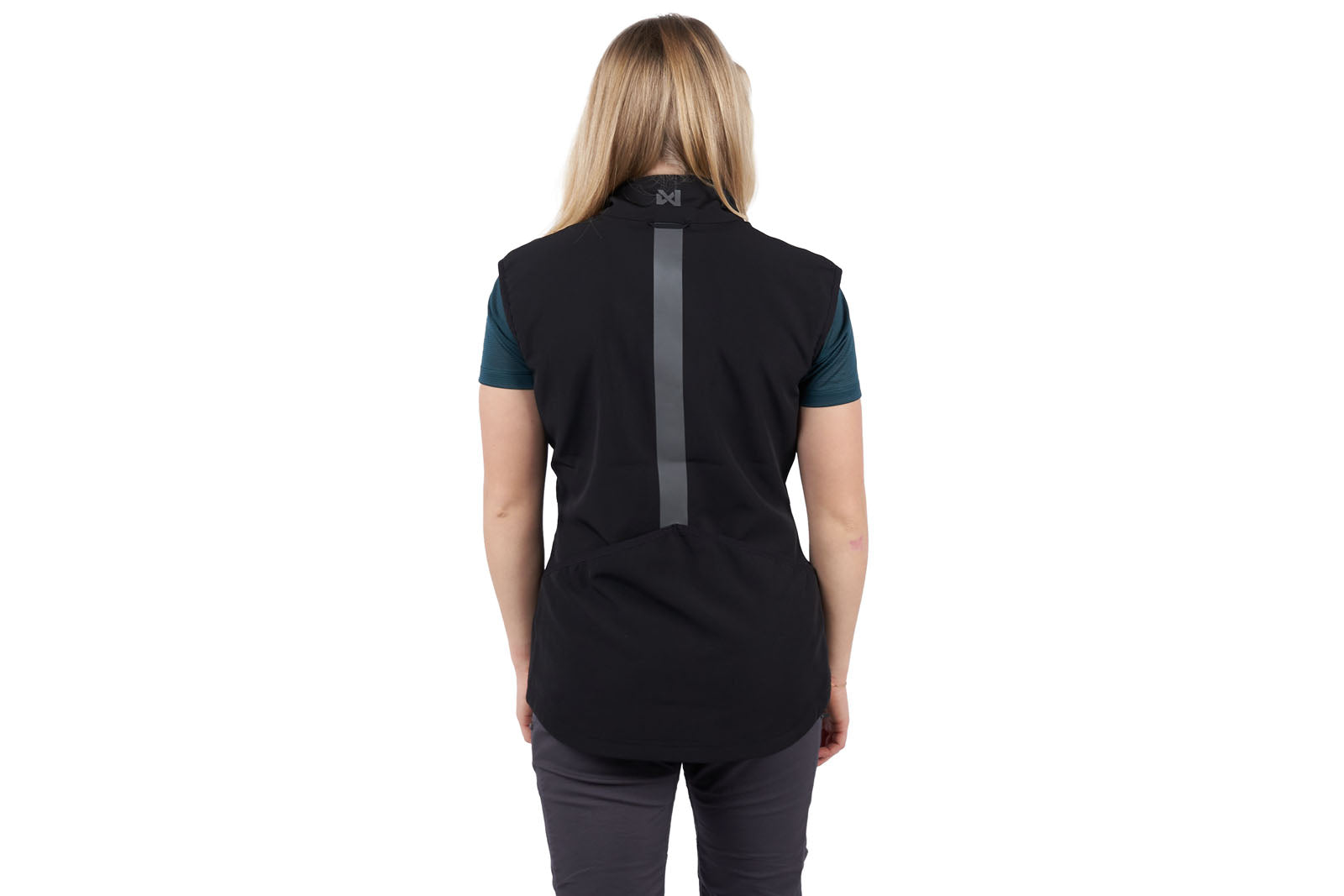 A woman wearing the Obedience Vest Light, with a reflective strip on the back.