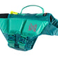 Stock image of the Protector Life Jacket, a teal lifejacket with a handle for dogs, against a white background.
