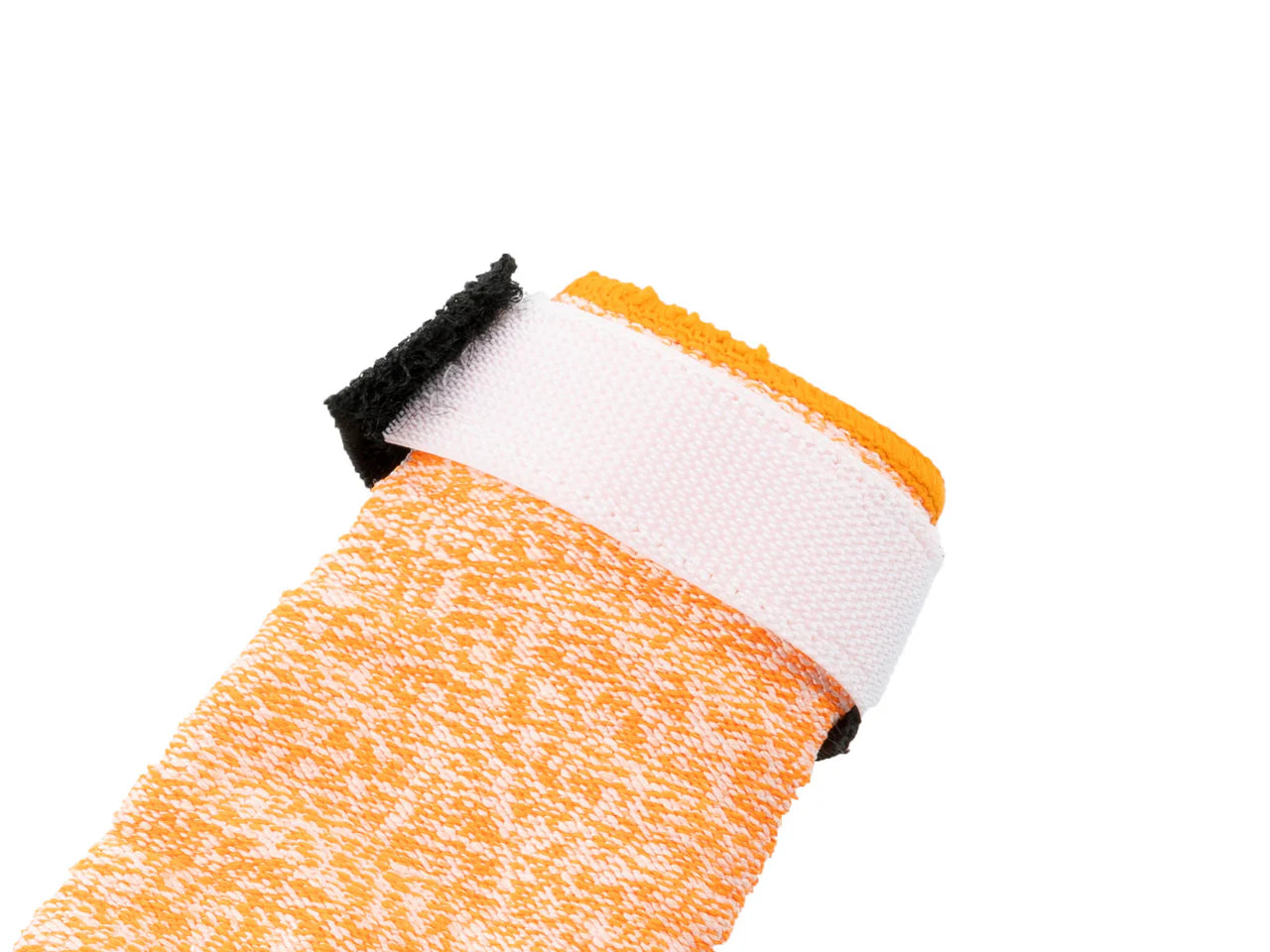 Close-up of the cuff of the Protector Booties High on a white background.