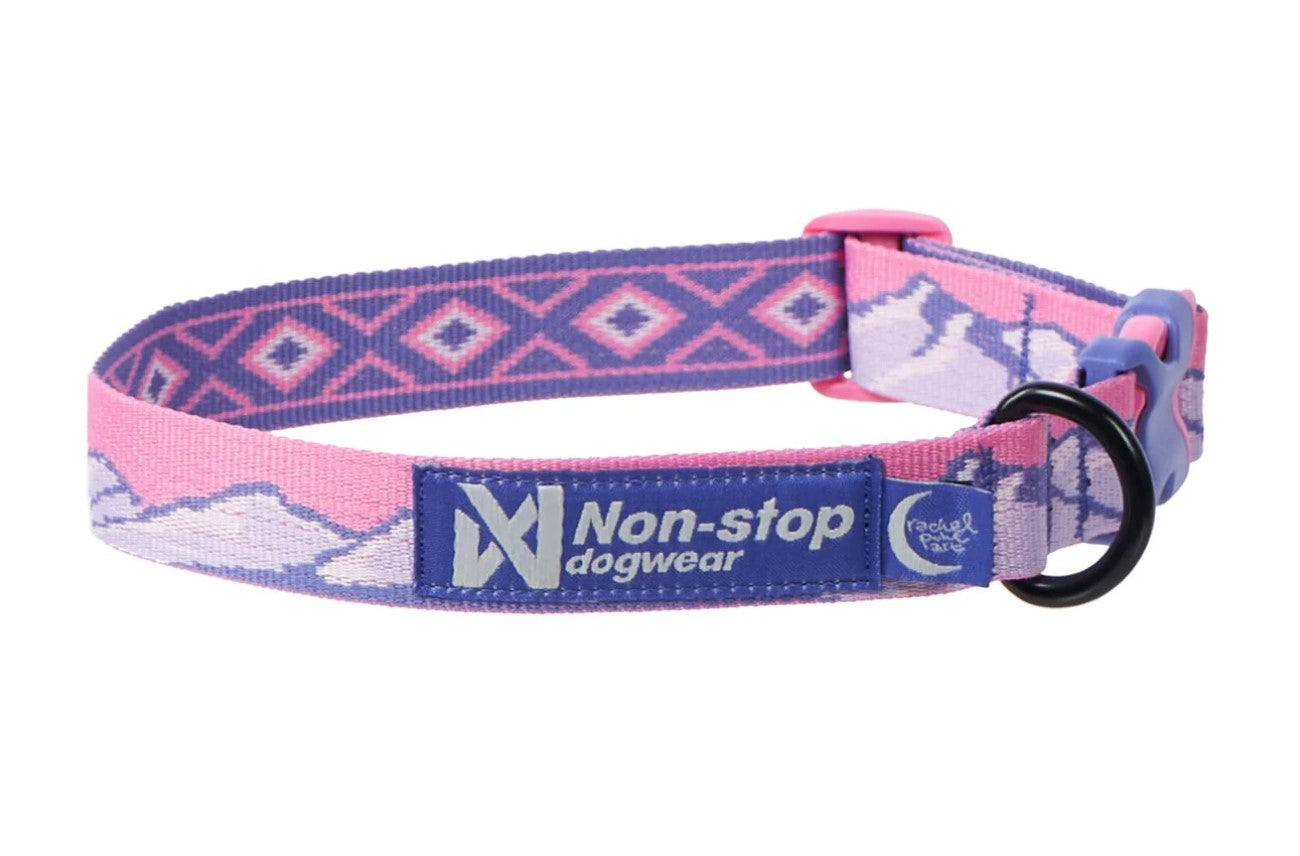 Stock image of the Rachel Pohl Trail Quest Collar in Pink and Purple, with mountain patterns, on a white background.