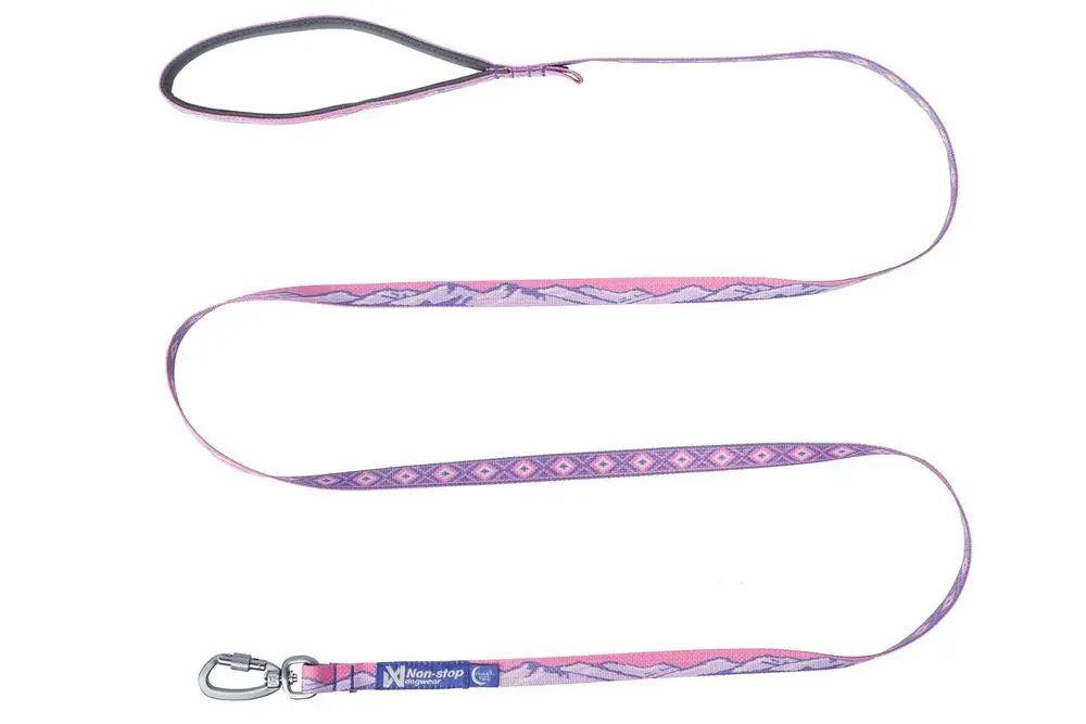 Stock image of the Trail Quest Lead, a pink and purple dog lead with mountain patterns, on a white background.