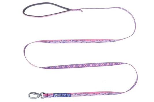 Stock image of the Trail Quest Lead, a pink and purple dog lead with mountain patterns, on a white background.