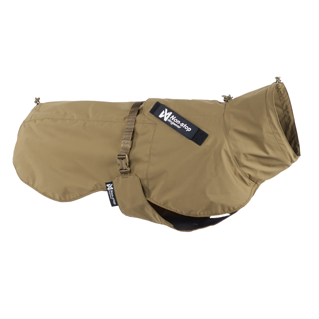 Stock image of the Working Dog Fjord, a khaki dog coat with a visible brand label on a white background.