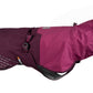 Stock image of the Fjord Raincoat, a two-tone purple dog coat, on a white background.