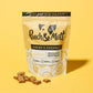 Pooch & Mutt Shrimp & Coconut treats on a yellow background.