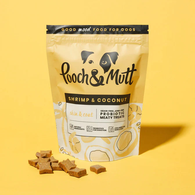 Pooch & Mutt Shrimp & Coconut treats on a yellow background.