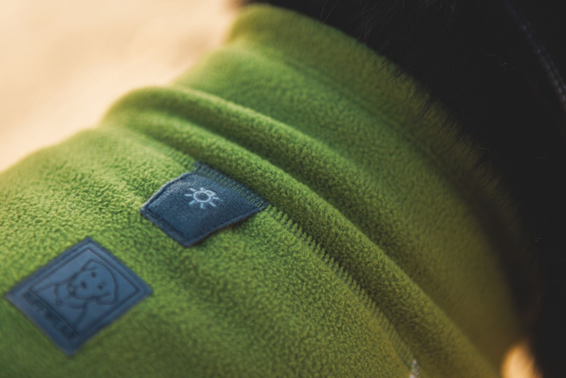 Lifestyle image of the Climate Changer Fleece Vest in Cedar Green, showing the light loop of the jacket.