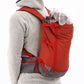 Stock image of the Hitch Hiker Carrier in Red Clay, being worn on the back of someone, on a white background.