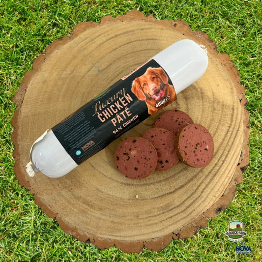 Nova Chicken Pate on a log, with some cut slices.