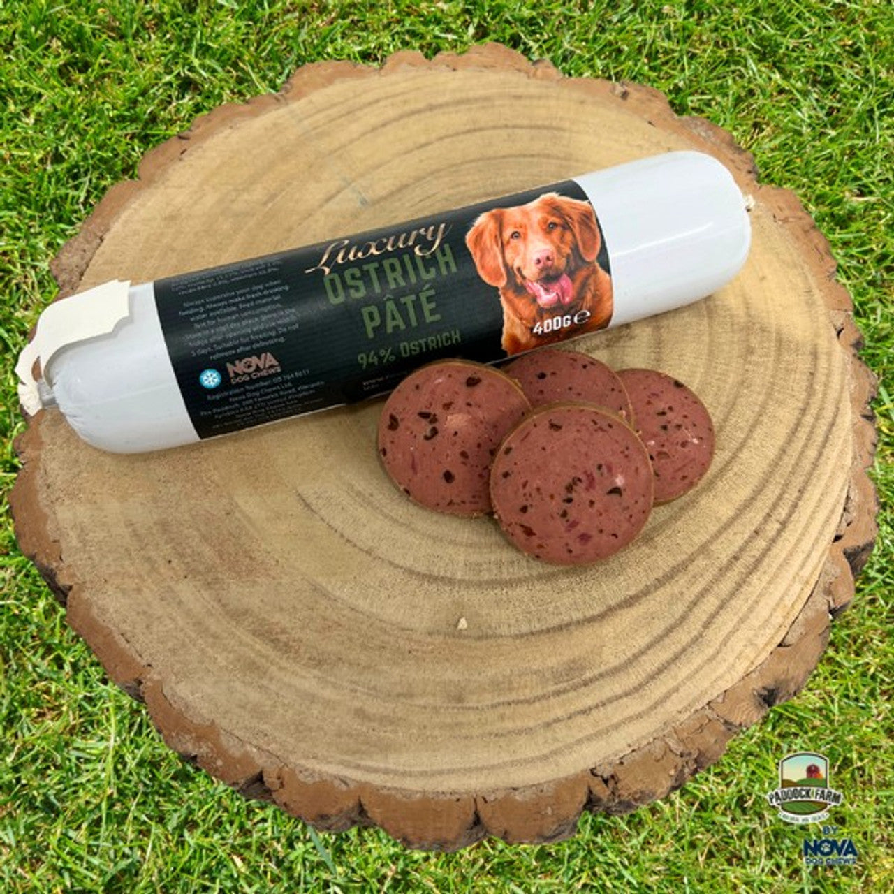 Nova Ostrich Pate on a log, with some cut slices.