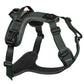 Stock image of the Ramble Harness, a dark green harness with a handle, on a white background.