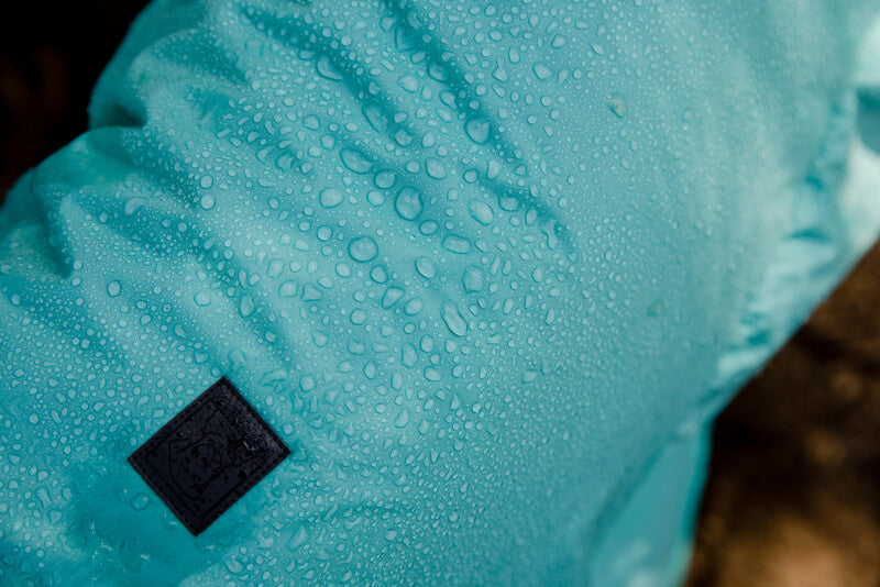 Lifestyle image of water droplets on a Dirtbag Dog Towel.