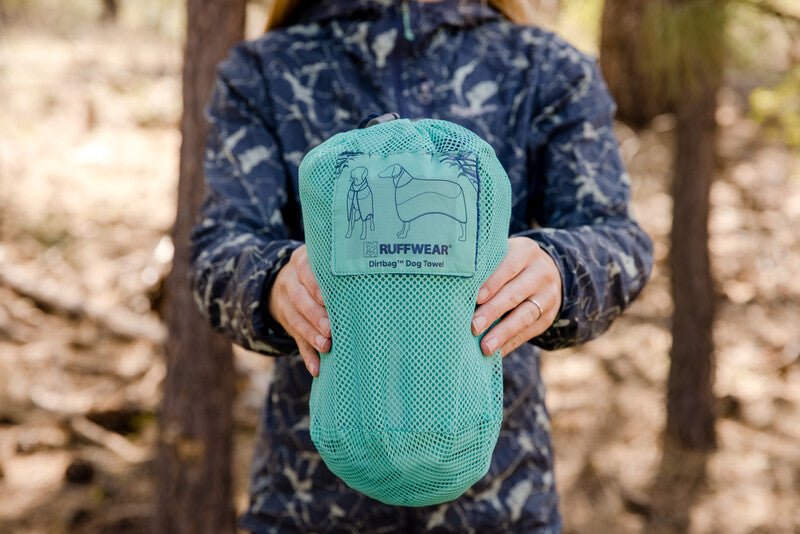 Lifestyle image of the Dirtbag Dog Towel packed away.