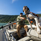 Dog wearing Ruffwear Brush Guard on a boat.