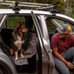 Dog and owner, getting ready for adventures in their car.